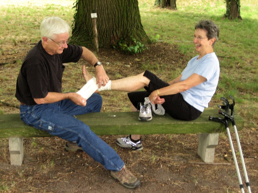 John and Ginny Bryant wrapping her sprained ankle \n (Click for next picture)